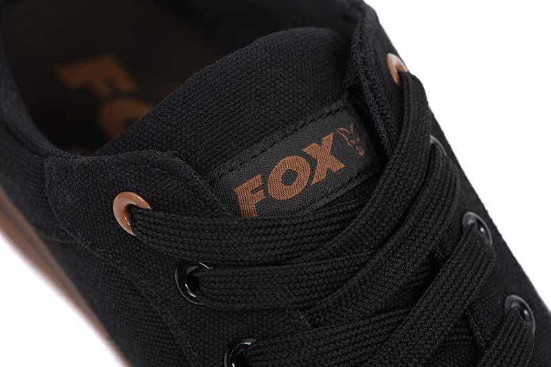 Zapatillas Fox Canvas Black close-up, showcasing logo and laces for carpfishing and casual wear.